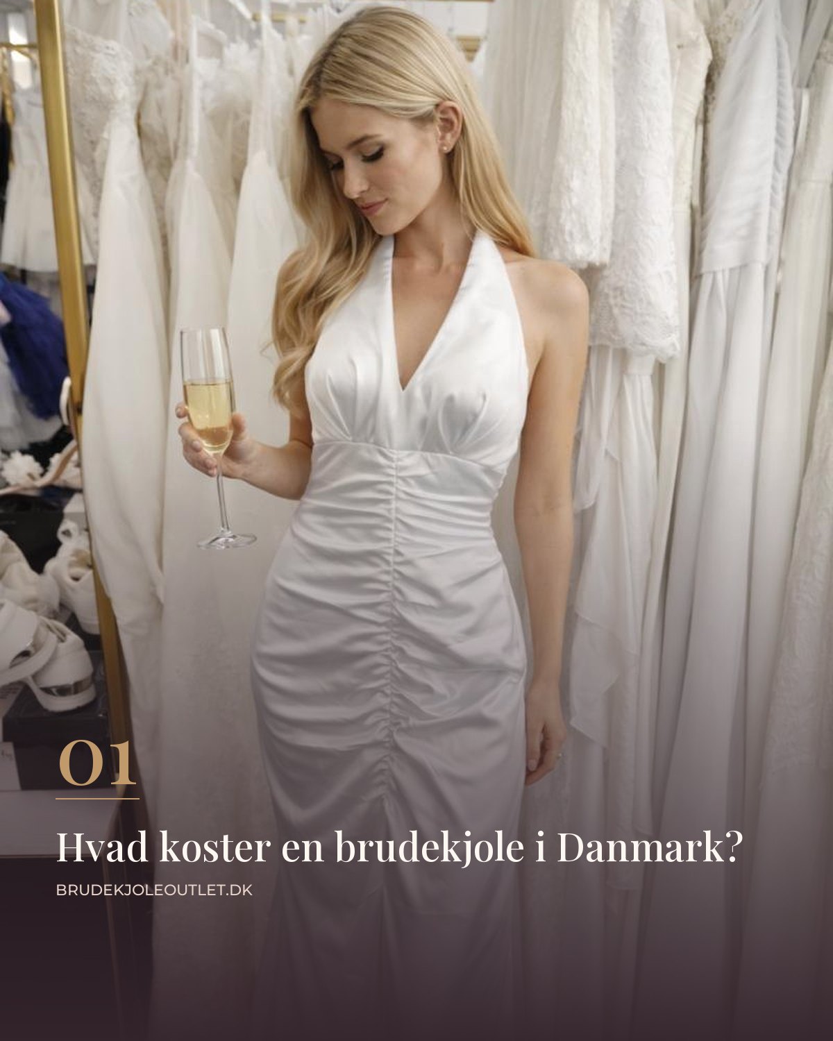 Brud i hvid satin brudekjole med halterneck og draperet liv mellem stativer med brudekjoler