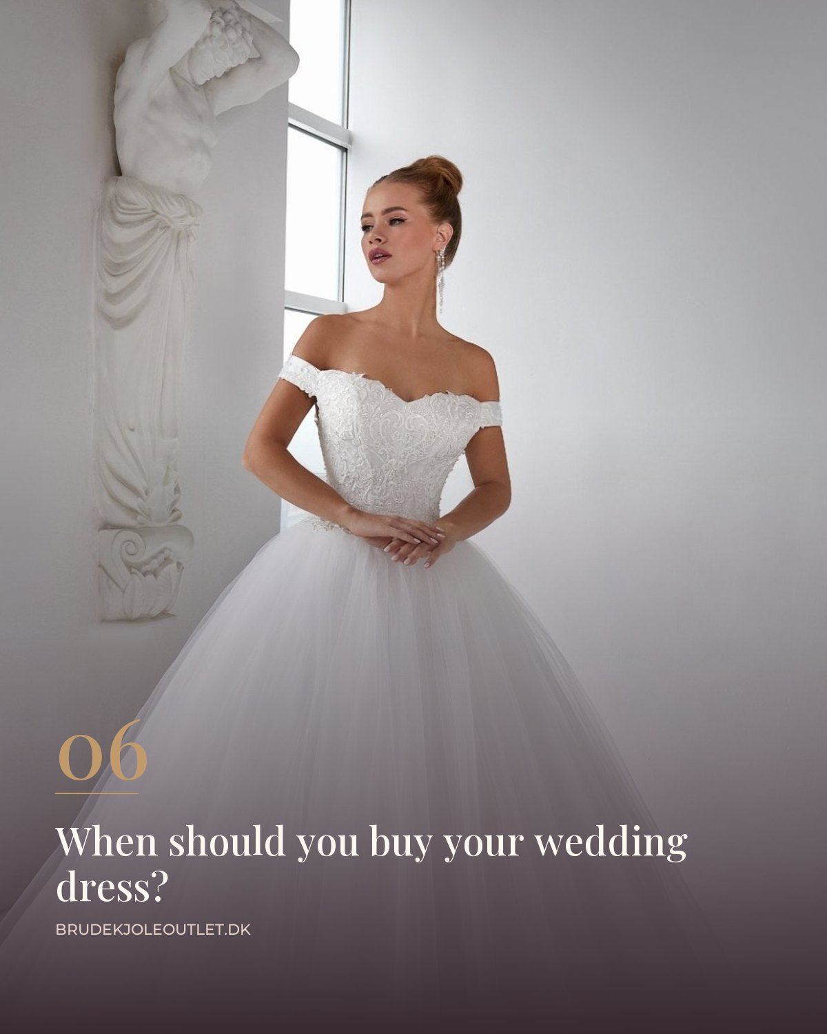 Off-the-shoulder ball gown wedding dress with a big tulle skirt in a bright room